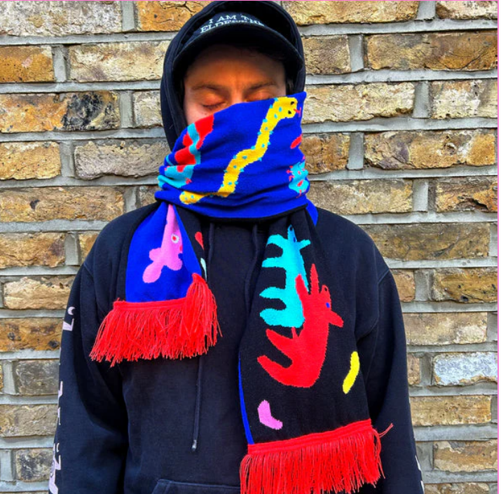 a colourful scarf wrapped keeping someone warm