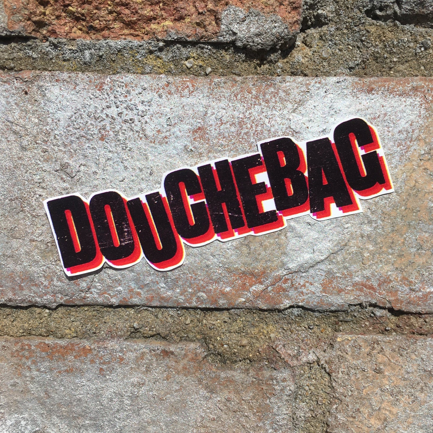 6049f0ff45e42d1cbc99c46b_douchbag-sticker-2_1750949467354.jpg