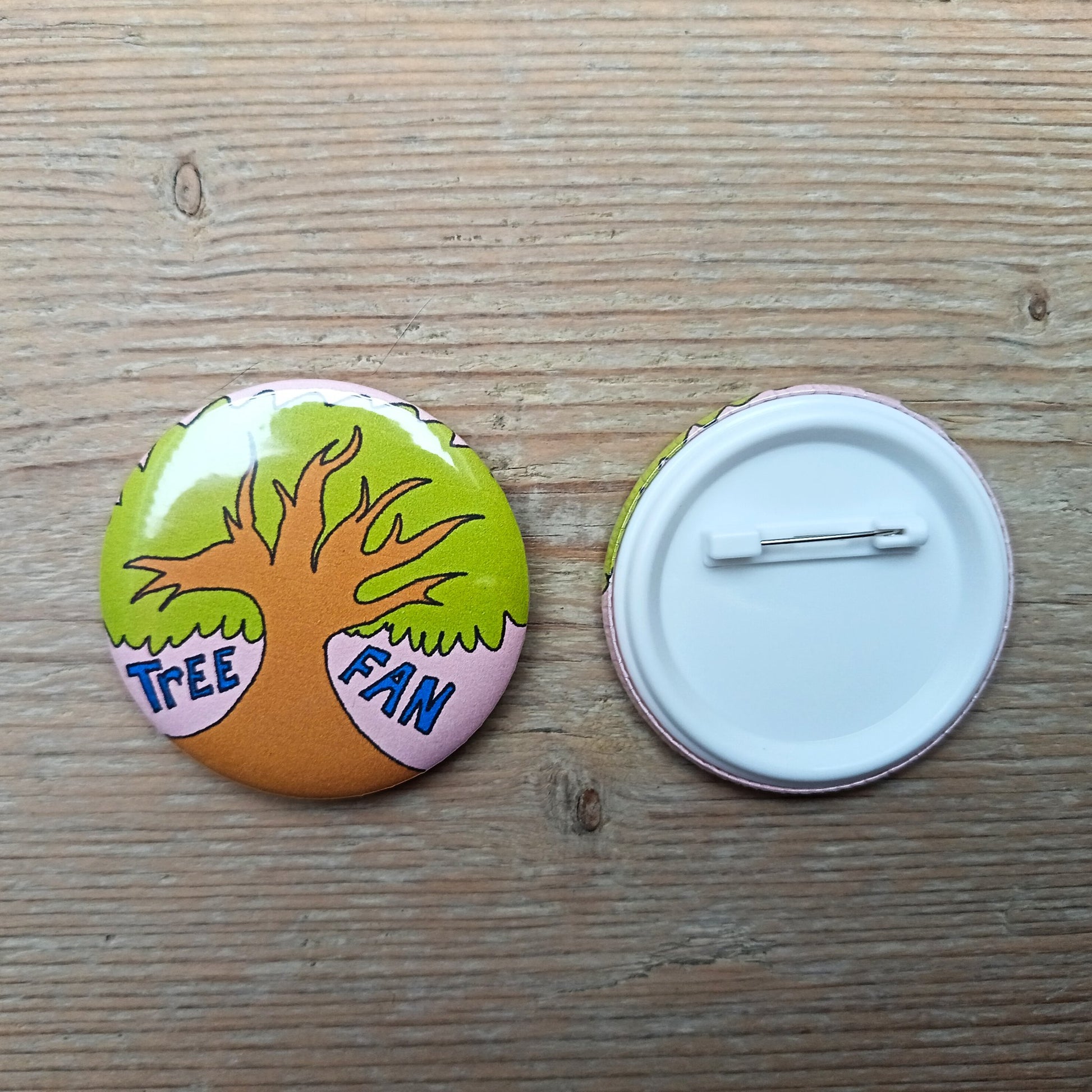 6049f0ff45e42d1cbc99c46b_tree-fan-bagde-front-and-back_1760702499155.png
