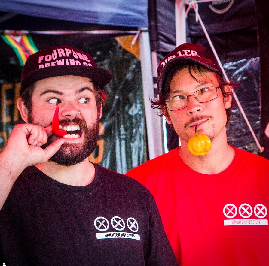 Founder of Brighton Hot Sauce eating a chilli
