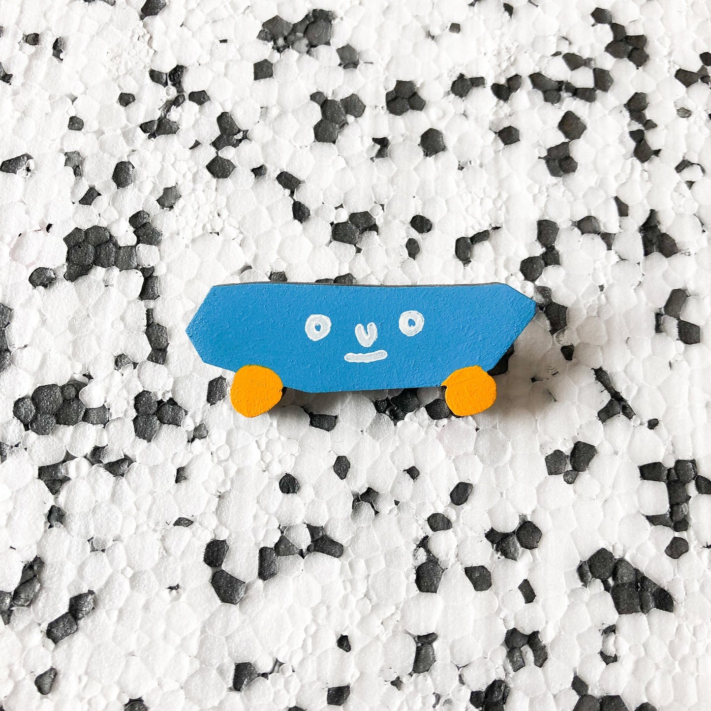 Skatebaord Shapeshifter Badge-Neighbourhood Store