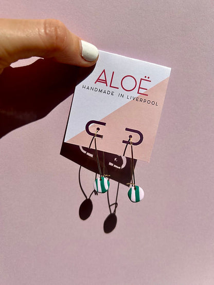 24k Gold Plated Mini Pink & Green Wavy Oval Hoops displayed on Aloe branded card, featuring delicate 30mm hoops with striped clay discs in pastel pink and green. Handmade in Liverpool. By Aloe Earrings - Collections: Jewellery, Gifts Under £15, Gifts under £20, Earrings, Face, Aloe Earrings