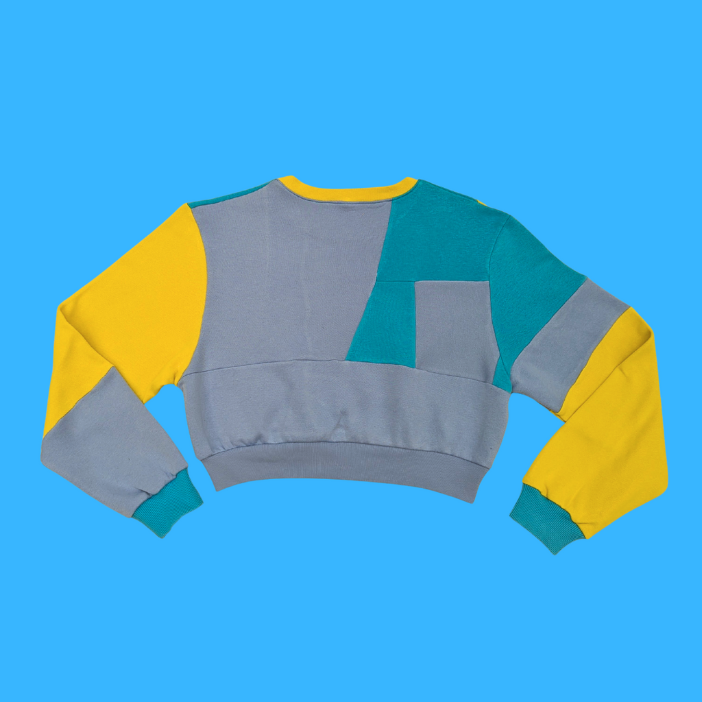 6049f0ff45e42d1cbc99c46b_neighbourhood-store-club-tropicana-sustainable-sweatshirt-fruit-salad-medium-back_1752174290760.png