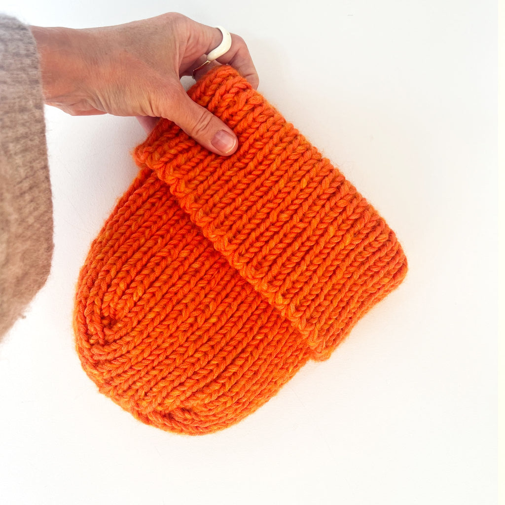 6049f0ff45e42d1cbc99c46b_ns-orange-beanie_1764587393543.jpg