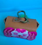 6049f0ff45e42d1cbc99c46b_pink-staffordshire-poo-bag-holder-2_1761138349249.jpg