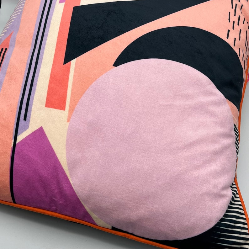 Geometric Pattern printed velvet cushion pinks/coral/lilac circle/black lines and stripes/cream