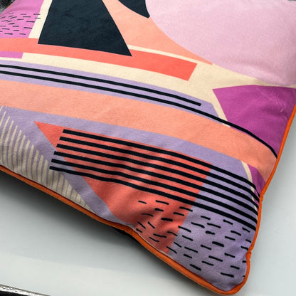 Geometric Pattern printed velvet cushion pinks/coral/lilac circle/black lines and stripes/cream