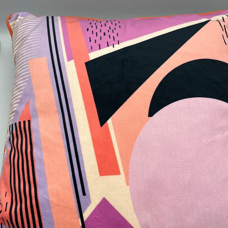 Geometric Pattern printed velvet cushion pinks/coral/lilac circle/black lines and stripes/cream