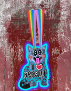 Shoreham kitty neon cat sticker with rainbow tail on red background