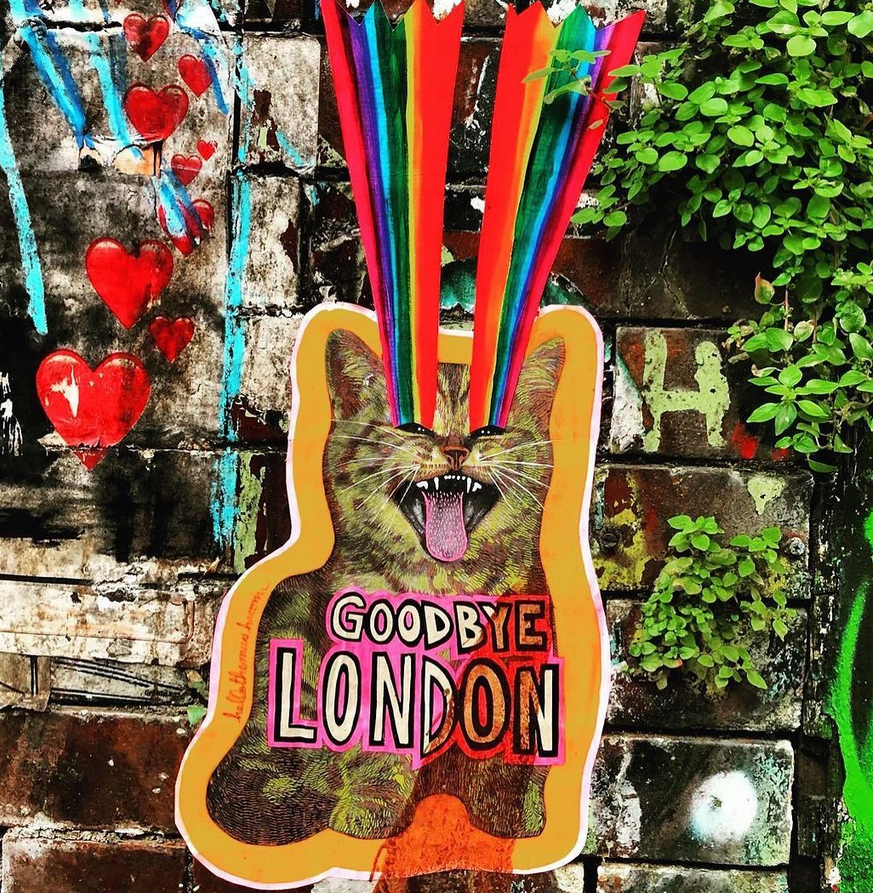 Shoreham kitty paste up with guitar goodbye London sign and streamers